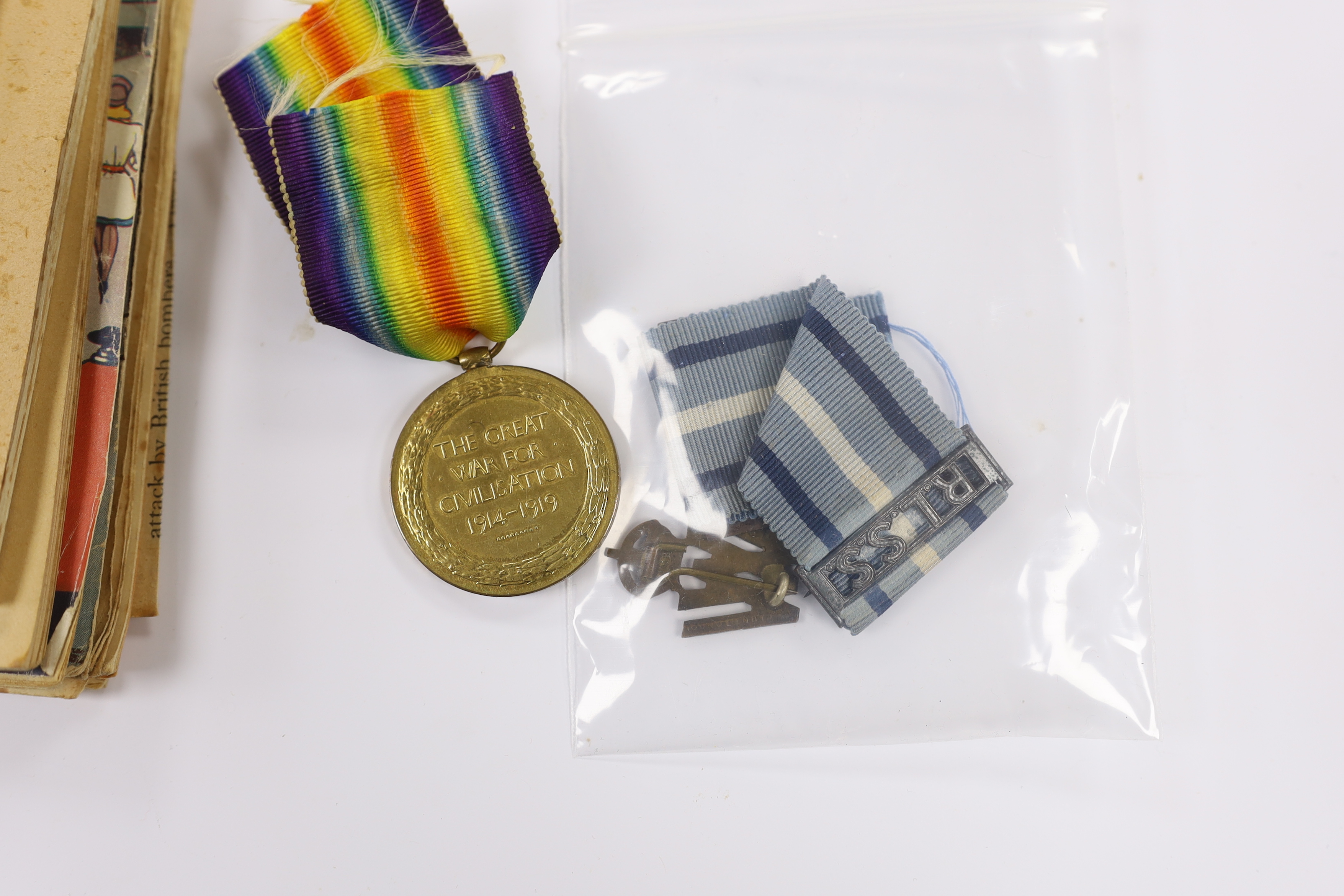 A First World War medal trio to Cpl. E.J. Hannaford, and a small collection of WWII publications including Home Guard instruction booklets, Civil Defence booklets, plus an R.L.S.S. ribbon and a WV badge, etc.
